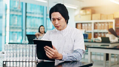 Buy stock photo Science, man and tablet with solution in laboratory for research notes, results and exam assessment. Japanese medical university, student and digital report for experiment review and scientific test