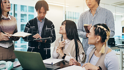 Buy stock photo Japanese business people, group and laptop for meeting, collaboration and writing notes in office. Teamwork, together and technology for brainstorming, discussion and project management as colleagues