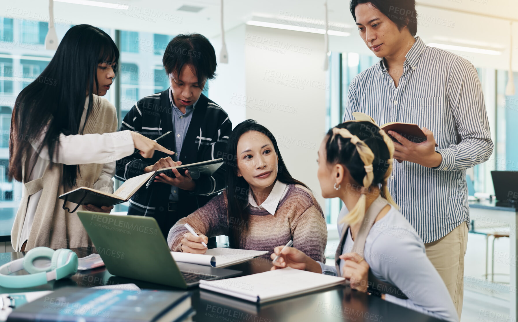 Buy stock photo Japanese business people, teamwork and laptop for meeting, collaboration and writing notes in office. Group, together and technology for brainstorming, discussion and project management as colleagues