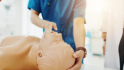 Buy stock photo Hands, medical students and first aid for emergency, education and practical training in hospital. People, learning and healthcare in simulation for manikin, knowledge and cpr with dummy in Japan