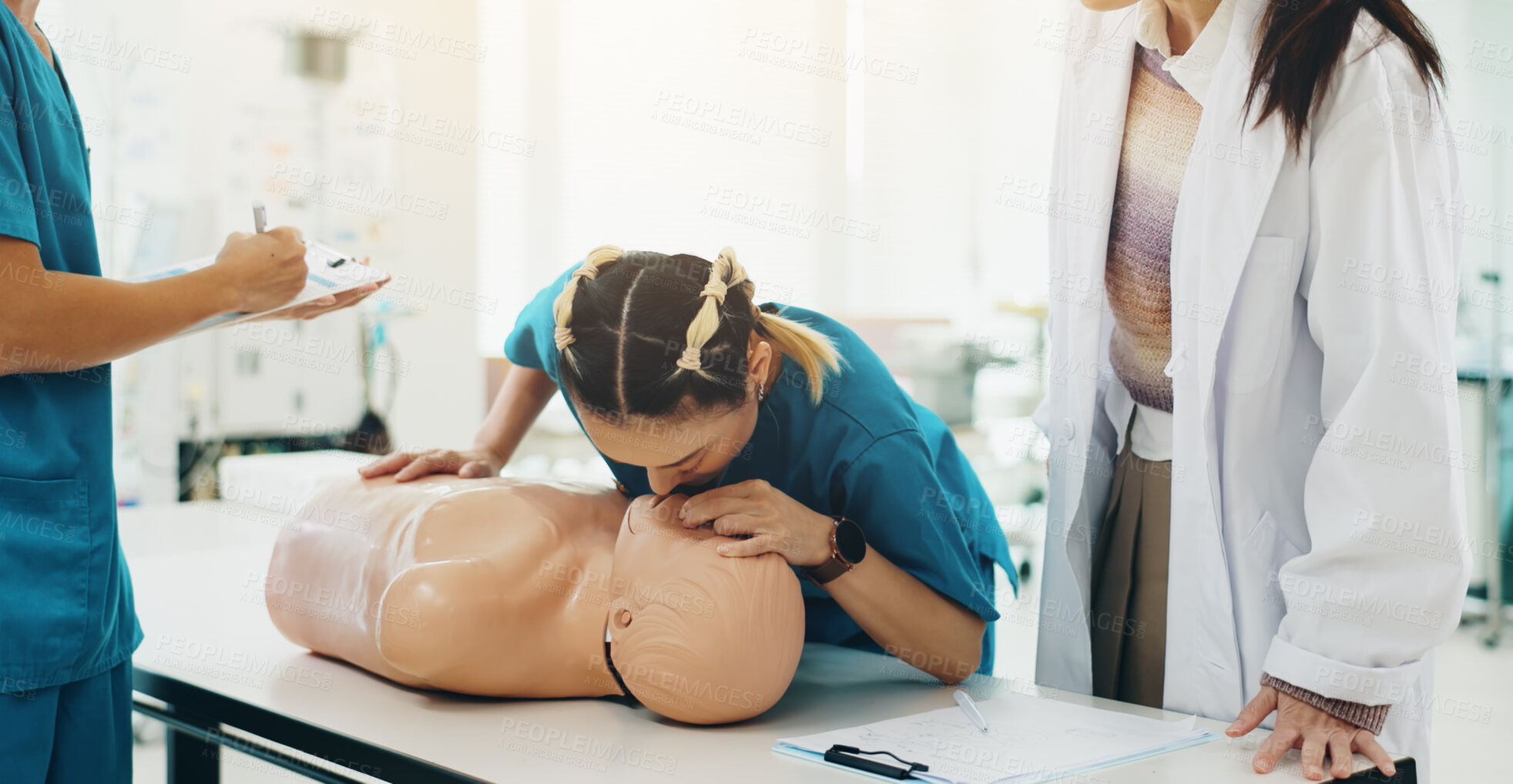 Buy stock photo Dummy, students and cpr training in hospital for medical simulation exam, test or assignment. Healthcare, professor and woman with rescue support demonstration on patient model at university in Japan