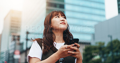 Buy stock photo Woman, thinking and phone for travel in town, trip and online map for navigation in city. Female person, location and explore internet for direction in Japan, contemplating route and plan commute