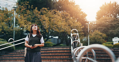 Buy stock photo Walking, steps and woman in city for travel with international exchange student program. Stairs, education and young female person on commuting journey in town for university or college in Japan.