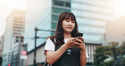 Buy stock photo Woman, phone and travel in city of Japan, walking and online for professional chat. Female person, commute and urban town for communication on app, business website and worker consulting on internet