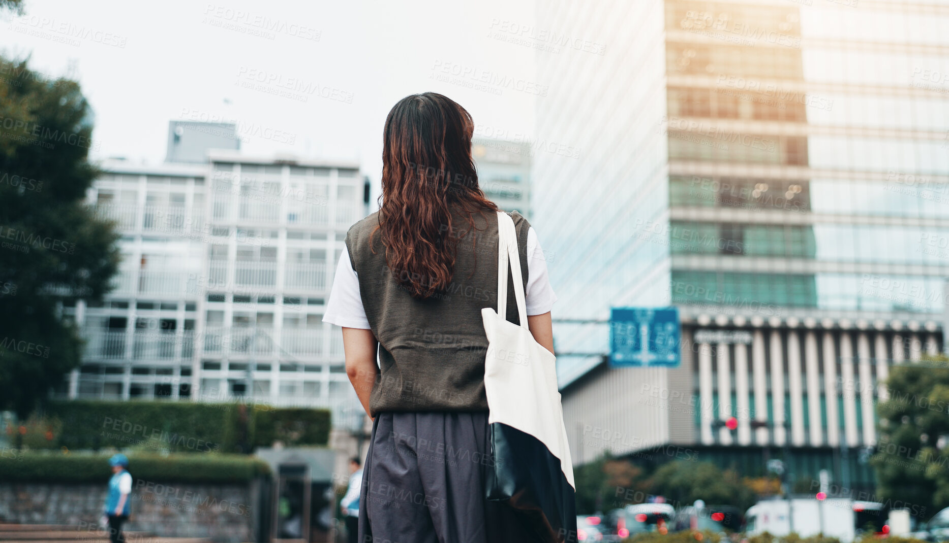 Buy stock photo Walking, bag and back of woman in city for travel with international exchange student program. Learn, education and young female person on commuting journey in town for university or college in Japan