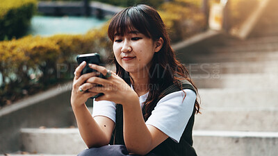 Buy stock photo Woman, phone and texting on stairs in city with contact, scroll or mobile app for booking taxi for travel. Girl, person and outdoor with smartphone, click and chat on social network on steps in Japan