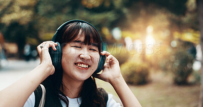 Buy stock photo Woman, headphones and worker travel in city, streaming playlist and online for listening. Female person, outdoor employee and hearing sound on journey in Japan, urban town and audio for commute