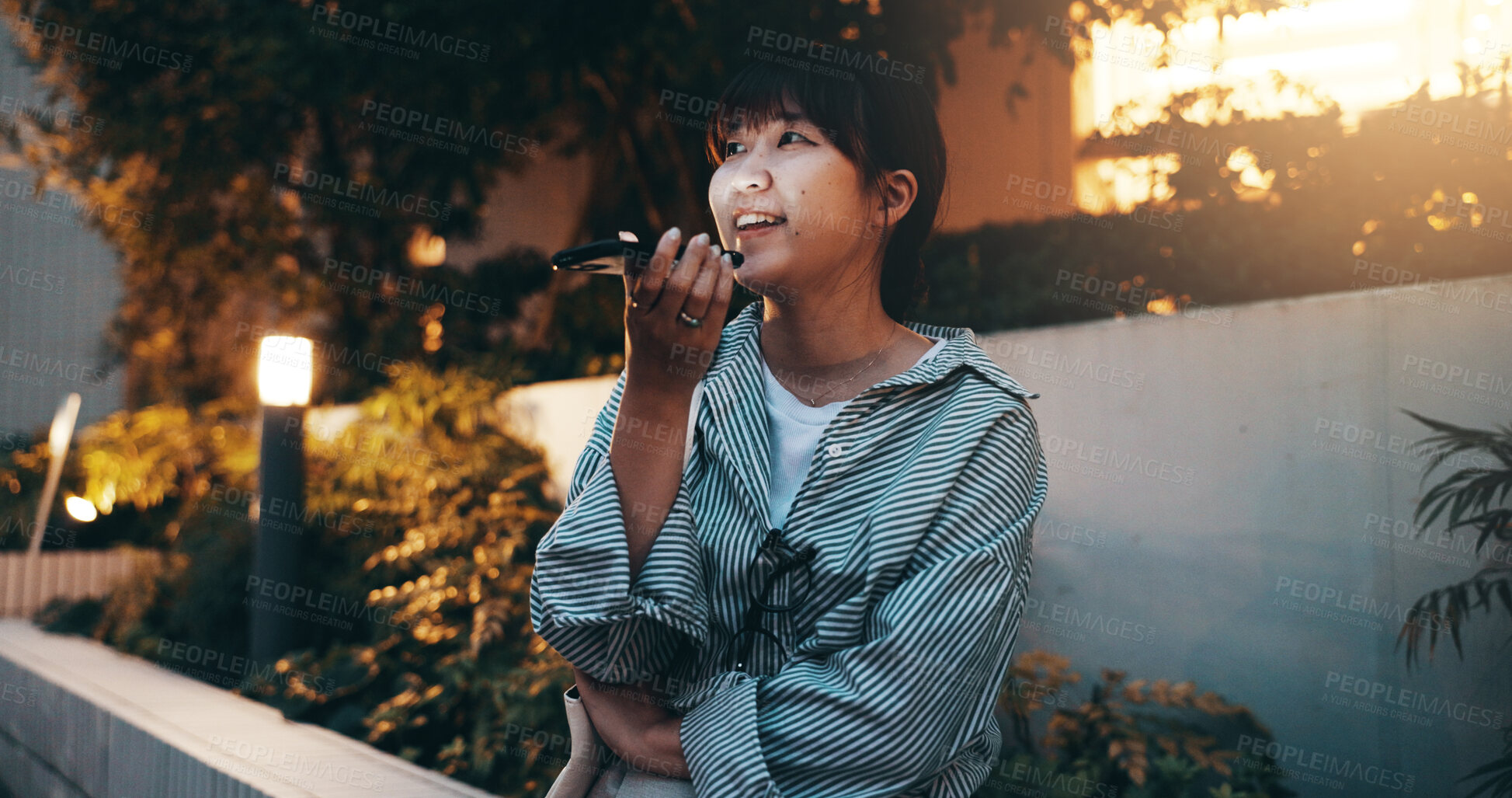 Buy stock photo Phone call, woman and talking with speaker outdoor for networking, voice recognition or ai virtual assistant. Japanese person, smartphone and happy for message recording, mobile chat or relax in park