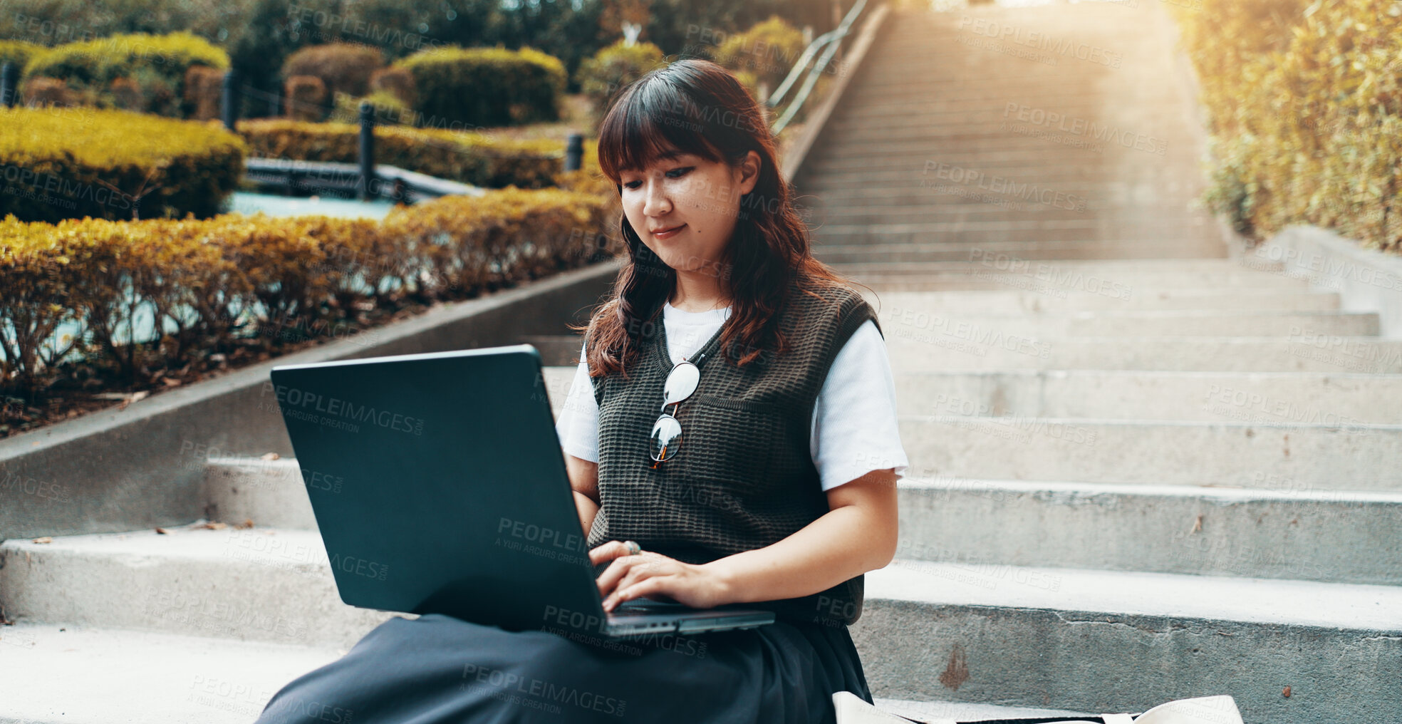 Buy stock photo Woman, laptop and outdoor stairs for university, student studying and online for assignment. Person, campus park and college website for module learning, education and course for knowledge in Japan