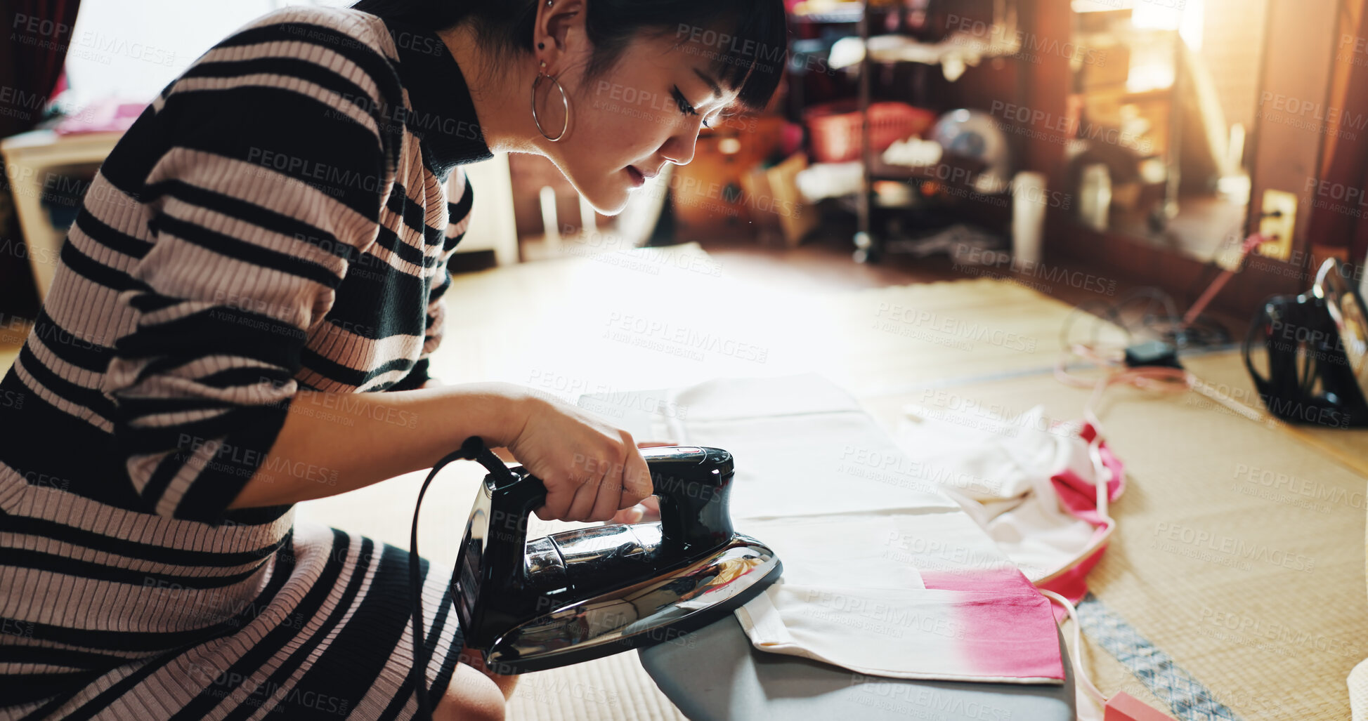 Buy stock photo Fashion designer, seamstress and Asian woman in workshop with iron for heat, steam or clothing press. Small business, boutique and person with material, fabric or textiles for tailor service in Japan