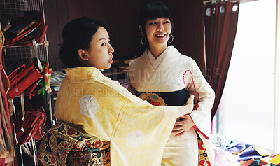 Buy stock photo Asian woman, tailor and size with garment for kimono, style or dress making at boutique. Japan, female person or fashion designer with customer, fabric or waist belt for clothing design at store