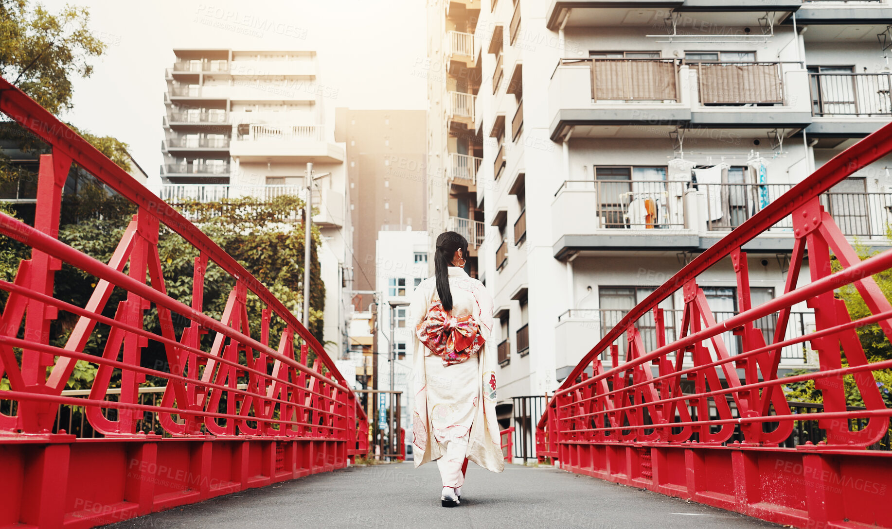 Buy stock photo Back, bridge and kimono with woman in city of Tokyo, Japan for culture, sightseeing or travel. Adventure, explore and walking with person outdoor in urban town at location for history or tradition