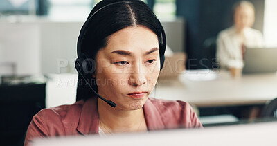 Buy stock photo Business, call center and woman in office, tech support and help desk with headset, contact us and crm. Japanese person, employee or agent in workplace, serious and customer service with computer