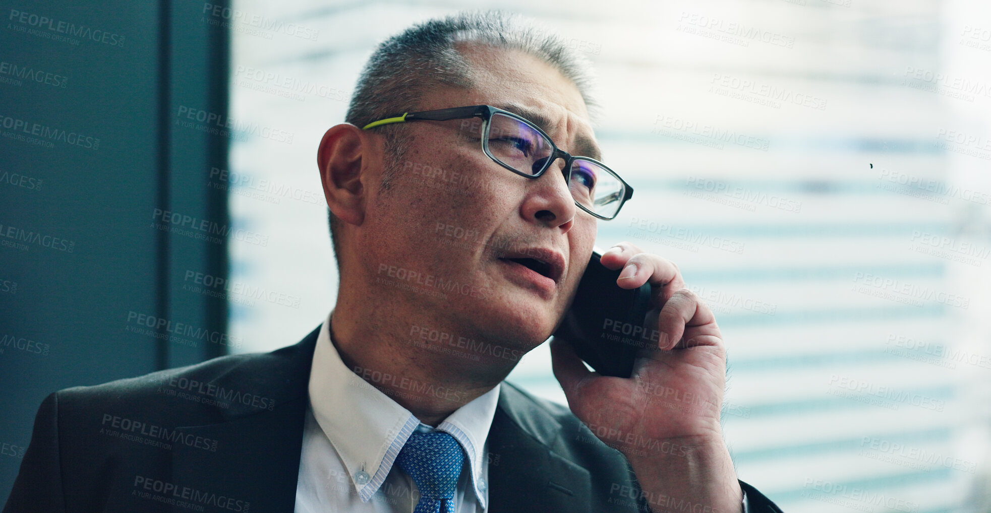 Buy stock photo Phone call, office and mature Asian man by window for contact, communication and online chat. Corporate, business manager and person on smartphone for talking, networking and discussion in Japan