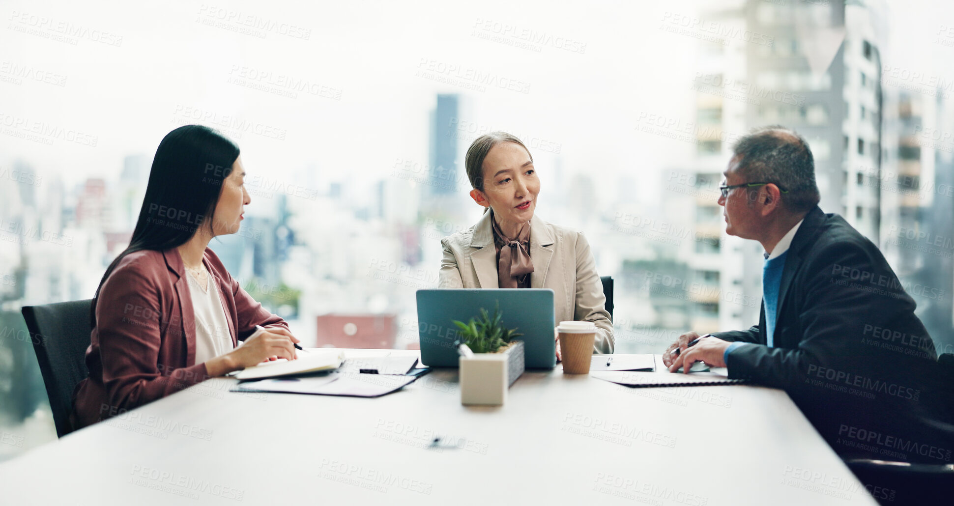 Buy stock photo Asian, business people and meeting with corporate discussion for negotiation, conversation or deal at office. Japan, group or employees with laptop or documents for company proposal at workplace