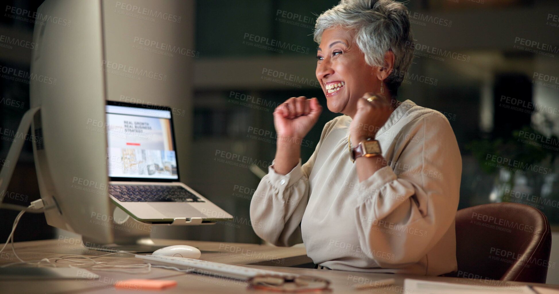 Buy stock photo Excited, mature woman and night with winning for promotion, good news or prize at office. Happy, female person or employee with smile or fist pump for business offer or salary increase at workplace
