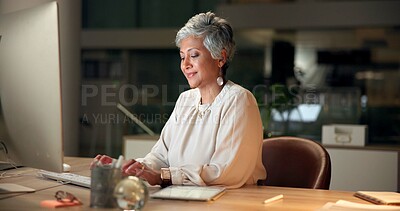 Buy stock photo Typing, computer and mature businesswoman in office at night with email for global client report. Technology, career and female financial executive with online investment revenue in workplace.