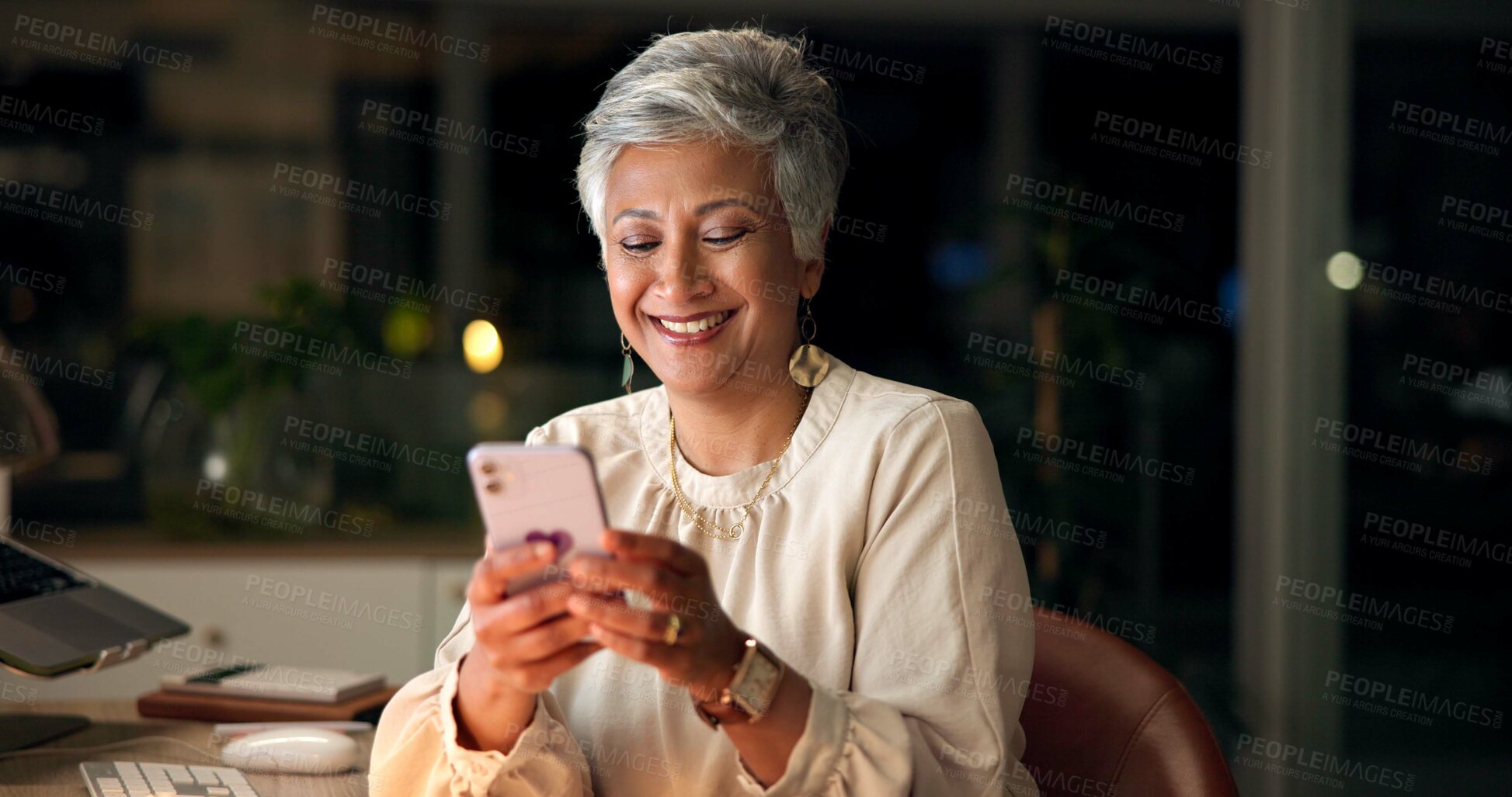 Buy stock photo Hands, business and night with woman, smartphone and typing with connection. Mature person, employee or consultant in modern office, cellphone or network with message to contact, smile or digital app