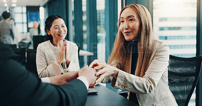 Buy stock photo People, happy and handshake in office for business deal, agreement or applause for successful merger. Company team, Japanese woman or shaking hands with man for welcome, settlement or new partnership