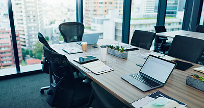 Buy stock photo Empty, table and laptop on table for conference room, corporate company and meeting boardroom. Vacant, interior furniture and chairs in workplace for planning, business brief and tech agency in Japan