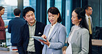 Business people, group and tablet at meeting, talking or networking at corporate conference in office. Woman, app and digital touchscreen for sign up at leadership workshop for career growth in Japan
