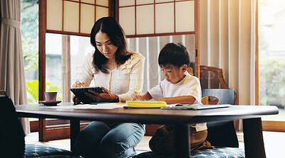 Buy stock photo Asian mother, child and learning with tablet for education, homeschooling or youth development at home. Mom, boy or kid with homework or technology for knowledge, creativity or tutoring in Japan