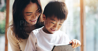 Buy stock photo Mother, son and tablet in home for bonding, playing games or streaming cartoon video with internet. Japanese family, boy and mom together with technology for teaching, development or online education