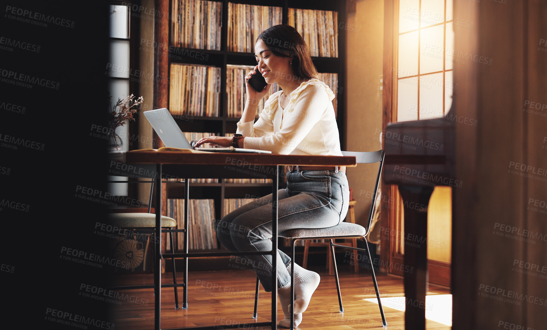 Buy stock photo Woman, smile and phone call at laptop for remote work, planning or negotiation feedback in home. Japanese person, tech or contact at table for discussion, brainstorming or consultation for networking