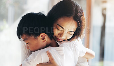 Buy stock photo Japanese, mother and hug son at house with love, care and bonding together for childhood development. Smile, woman and child with embrace for affection, family relationship and weekend visit in Japan