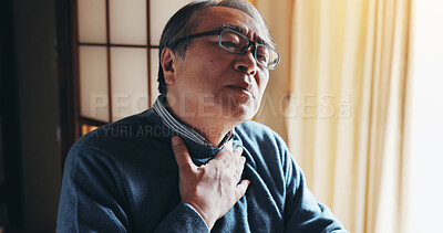 Buy stock photo Senior man, stress and chest pain in home with acid reflux, asthma attack and medical condition. Japanese person, retired or emergency in living room with lung infection, breathing difficulty or hurt