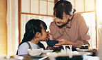 Japanese girl, family and eating in home with feeding, smile and noodles together with mom. Food, hungry and dinner table with love, care and support with chopsticks and meal for health and nutrition