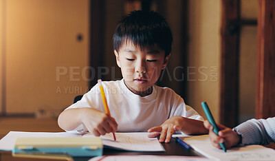 Buy stock photo Education, drawing and home school with kid, development and growth from homework. Siblings, sketch and Japanese boy with book, studying and lounge with youth learning and knowledge at table