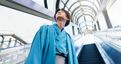 Buy stock photo Japanese man, thinking and escalator with traditional clothes, outfit and yukata for heritage. Guy, metro and holiday for culture, journey and sightseeing with casual dress kimono fashion in city