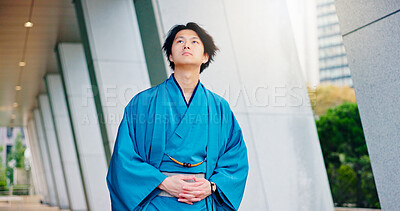 Buy stock photo Kimono, culture and thinking with Japanese man in city for Shinto ceremony, fashion and vision. Respect, travel and reflection with person in japan for traditional clothes, Buddhism and festival