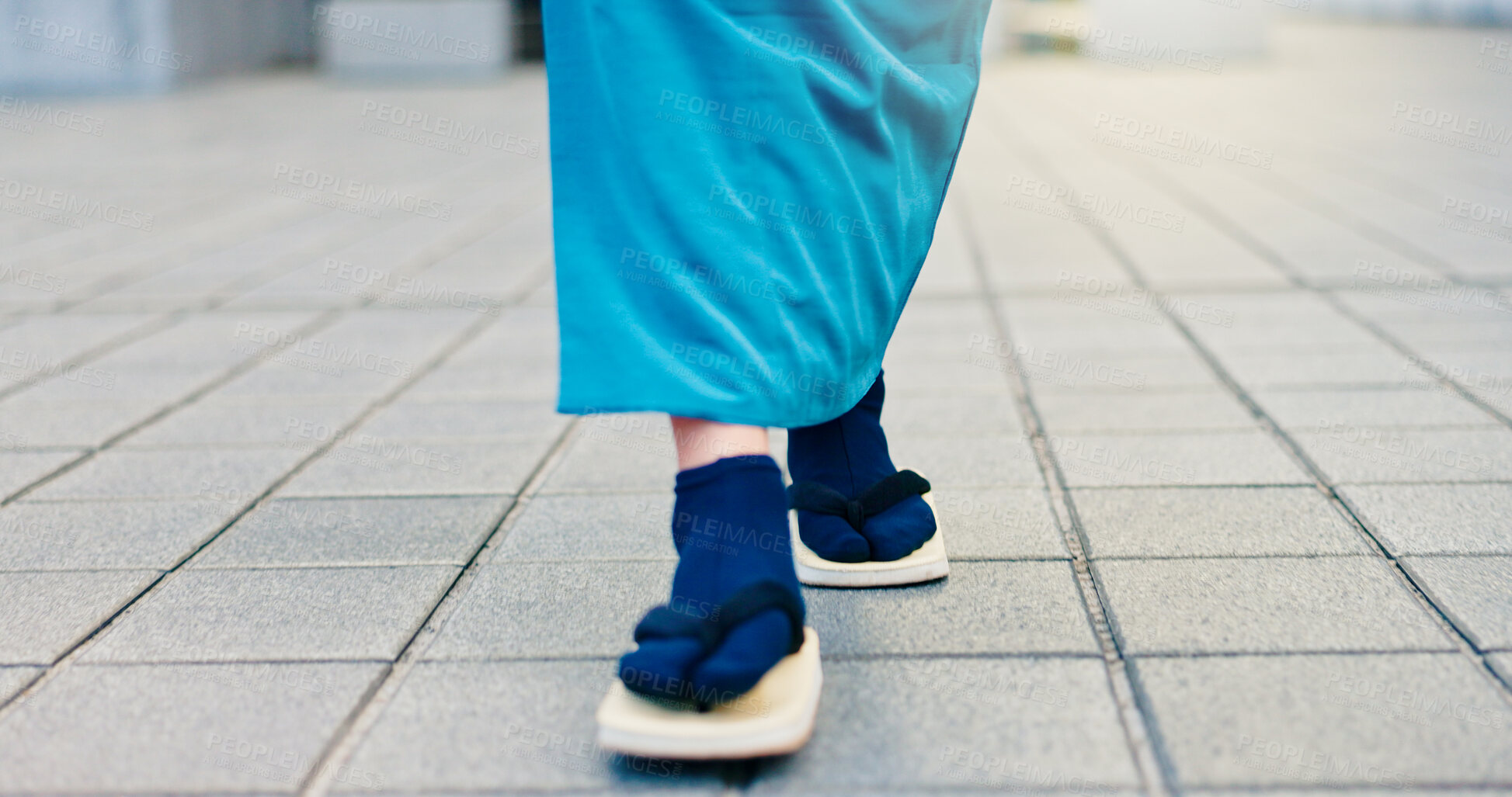 Buy stock photo Legs, slippers and walking in city street with traditional clothes, outfit and fashion for heritage. Person, feet and shoes for style, culture and kimono for travel, sightseeing or adventure in Japan