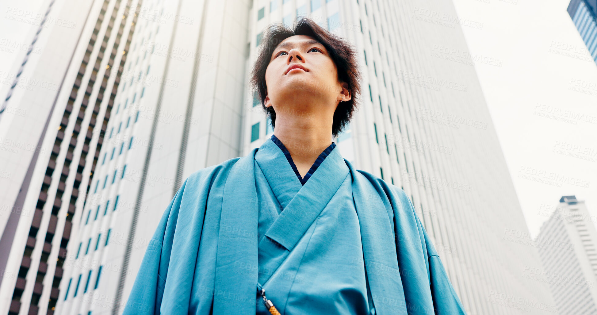 Buy stock photo Man, thinking and city travel with traditional clothes, outfit and yukata for heritage. Japanese guy, holiday and pride for culture, journey and sightseeing with casual dress kimono fashion downtown