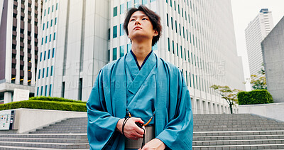 Buy stock photo Japanese man, thinking and city with traditional fashion, outfit and yukata for heritage. Travel, guy and vacation for culture, journey and sightseeing with casual dress kimono urban downtown