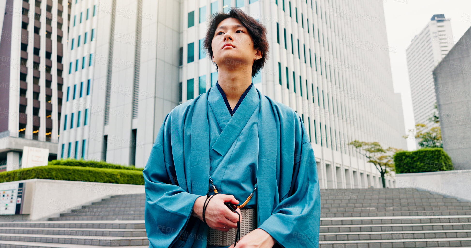 Buy stock photo Japanese man, thinking and city with traditional fashion, outfit and yukata for heritage. Travel, guy and vacation for culture, journey and sightseeing with casual dress kimono urban downtown