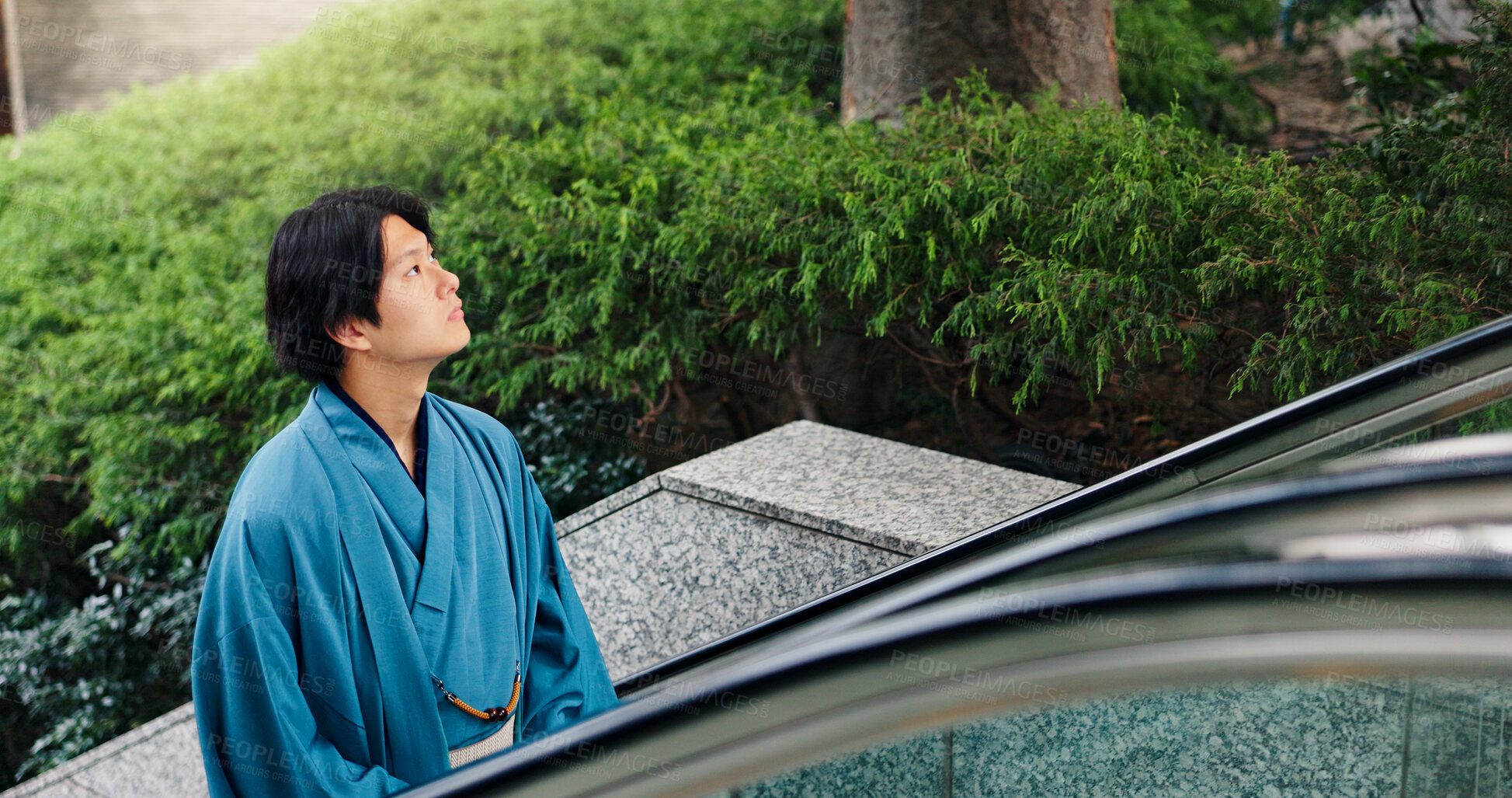 Buy stock photo Kimono, thinking and escalator with Japanese man in city for Shinto ceremony, fashion and culture. Respect, travel and reflection with person in japan for traditional clothes, Buddhism and festival