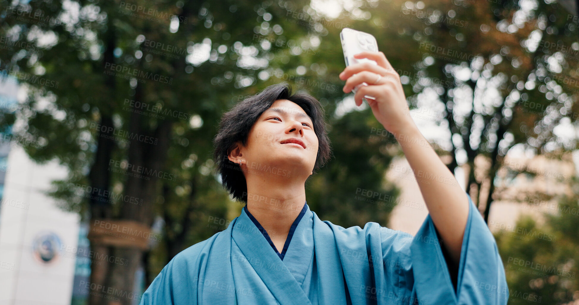 Buy stock photo Navigation, phone and Japanese man in nature for travel, vacation or weekend trip location. Cellphone, destination and male person outdoor with directions on tech for journey, adventure or holiday.