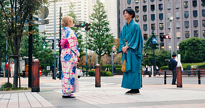 Buy stock photo Japanese people, city and fashion with traditional clothes, culture and kimono for heritage or style. Man, Asian woman and outdoor for pride, travel and outfit in street for dress, trip and clothing