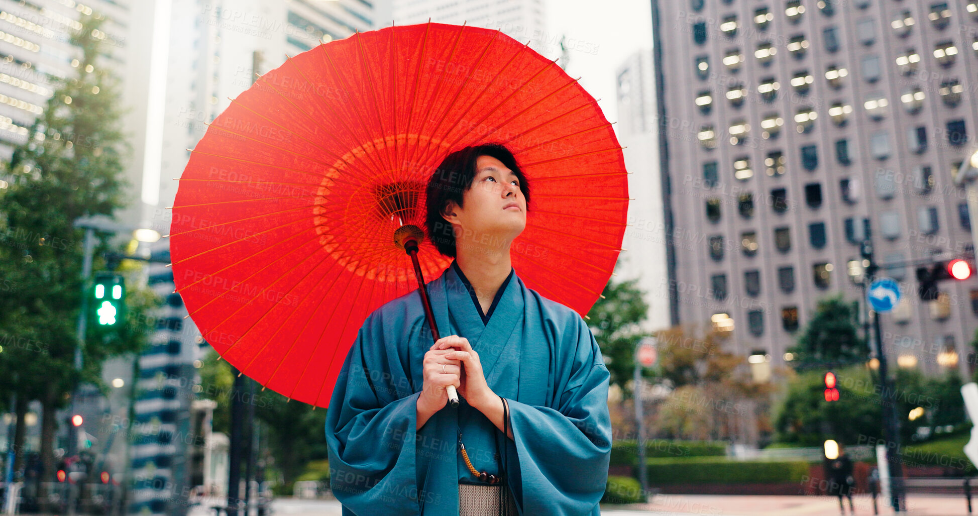 Buy stock photo Kimono, umbrella and vision with Japanese man in city for traditional ceremony, thinking and culture. Travel, fashion and pride with person and parasol in Japan for heritage, Buddhist and festival