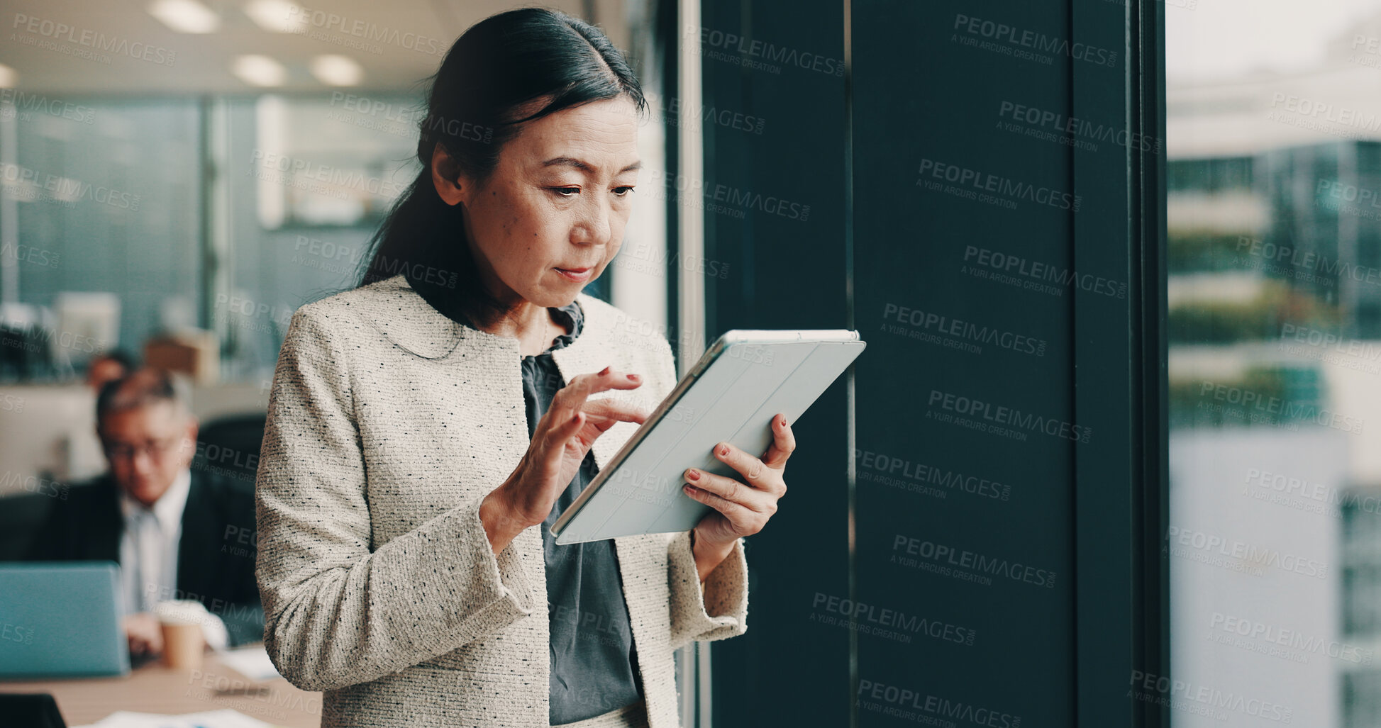 Buy stock photo Japanese, business and woman with tablet in office for research, corporate schedule and accounting proposal. Mature person, digital app and information for finance report, review investment and Japan