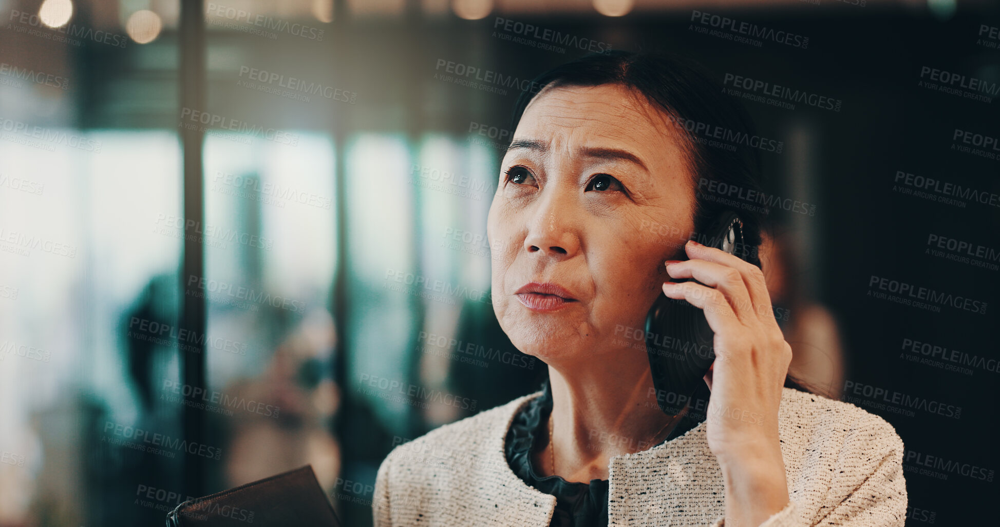 Buy stock photo Japanese, woman and office with phone call for communication, court ideas and networking with contact. Female person, mature lawyer and thinking with client for negotiation, business and mobile chat