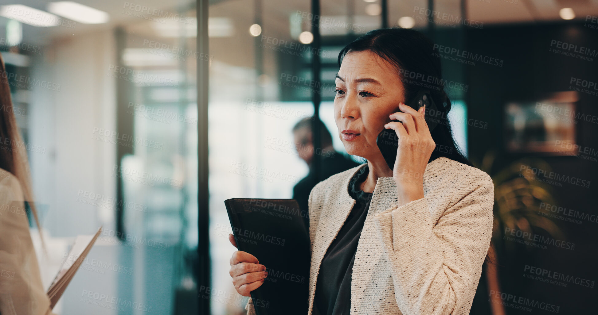 Buy stock photo Japanese, woman and communication with phone call in office, planning and networking with contact. Female person, mature lawyer or discussion with client for negotiation, business deal or mobile chat