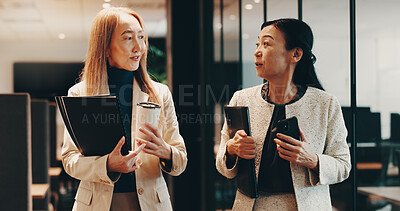 Buy stock photo Japanese, lawyers or people in office walking with coffee, folder or documents for funding review. Teamwork, morning or women speaking at law firm for legal project, case feedback or profit portfolio