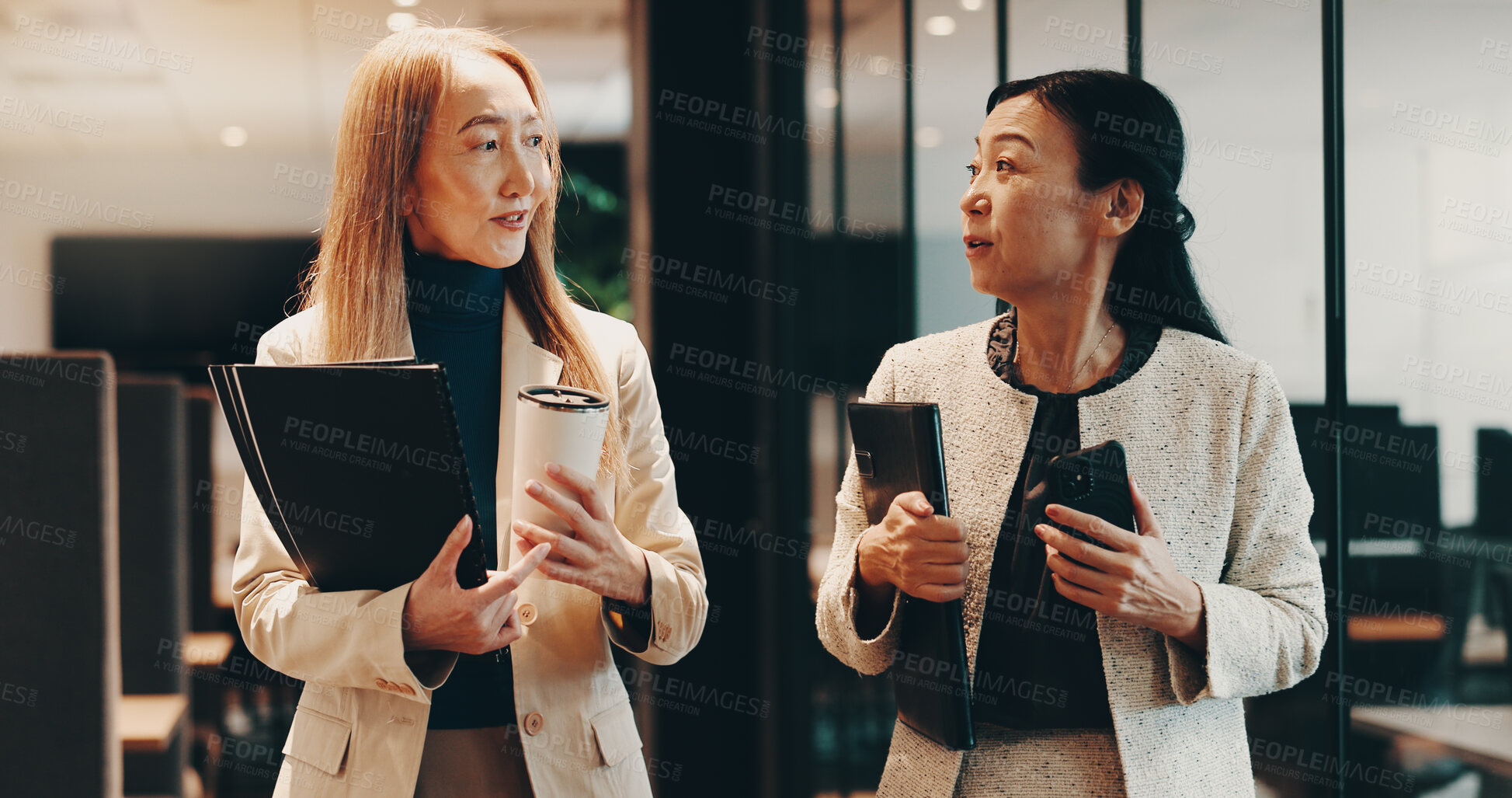 Buy stock photo Japanese, lawyers or people in office walking with coffee, folder or documents for funding review. Teamwork, morning or women speaking at law firm for legal project, case feedback or profit portfolio