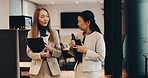Japanese, lawyers or women in office walking with coffee, folder or documents for funding review. Teamwork, morning or people speaking at law firm for legal project, case feedback or profit portfolio