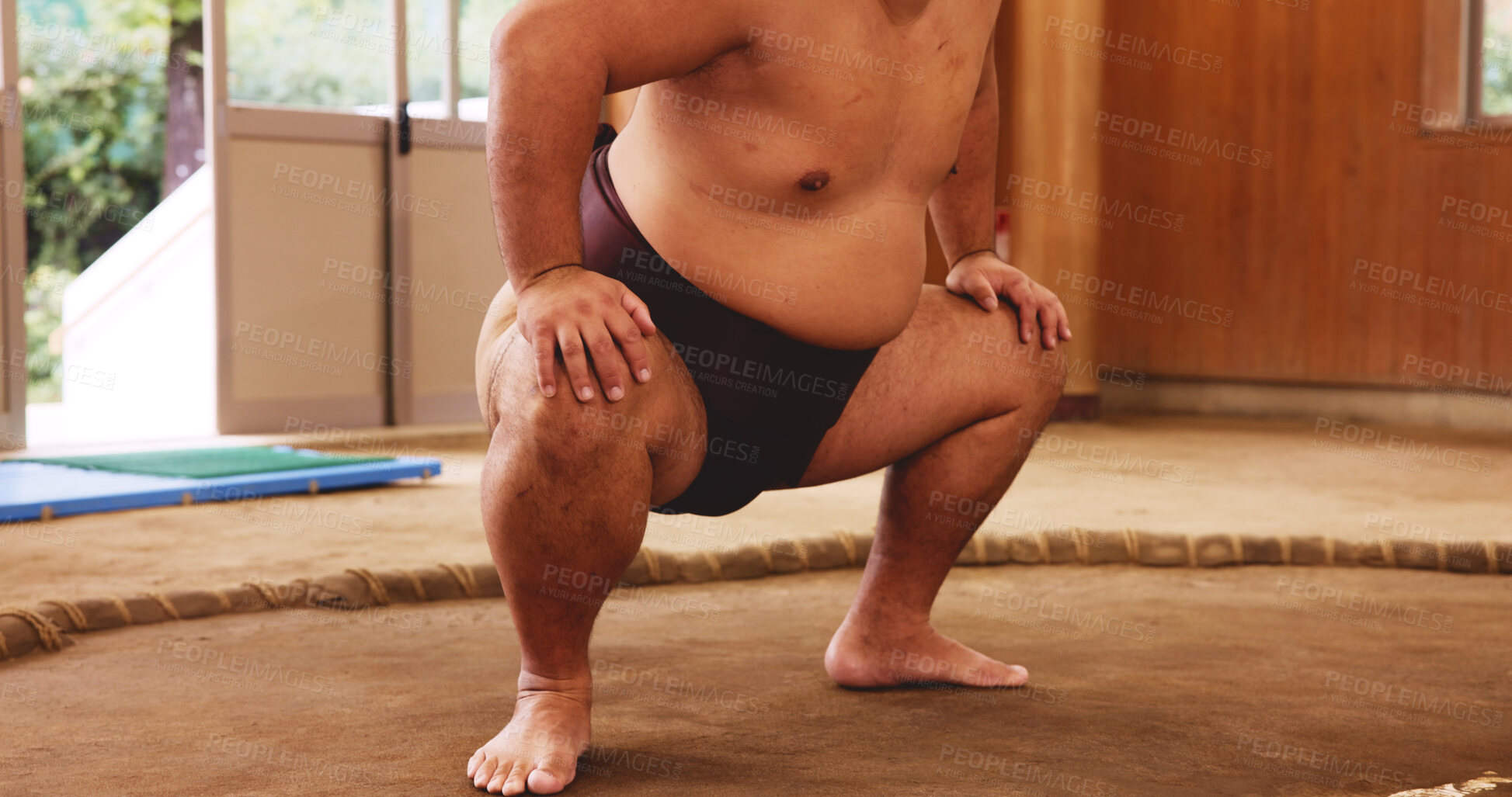 Buy stock photo Dohyo, mawashi and legs of Sumo wrestler closeup for martial arts competition or tournament in Japan. Fitness, power and strength with person in arena or ring for culture, heritage or national pride