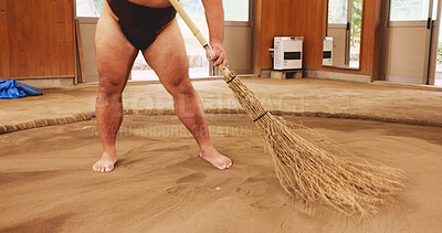 Buy stock photo Broom, dohyo and legs of Sumo wrestler sweeping sand in mawashi, getting ready for competition.  Cleaning, preparation and start with person in Japan for culture, heritage or martial arts tradition